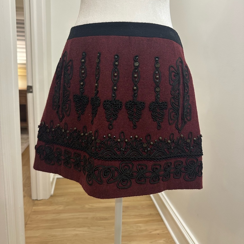Nanette Lepore mini skirt in burgundy with black beading/detailing size 4.